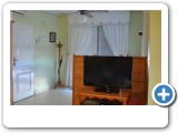 Different aspect of living room with its Satellite TV and DVD player
