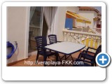 Terrace with patio furniture (table and chairs)